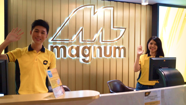 Magnum staff greeting at counter